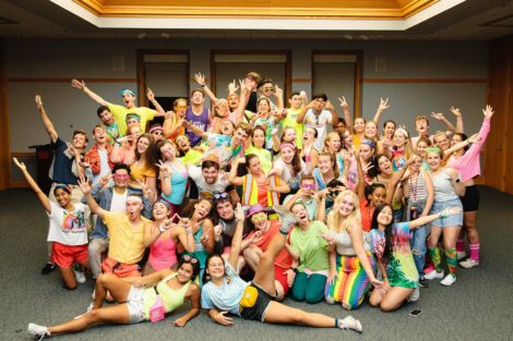 Students strike a pose for a group photo at the 80s Dance Party