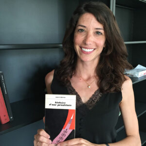 Caroline Sequin holds a memoir of World War II written in the 1960s.