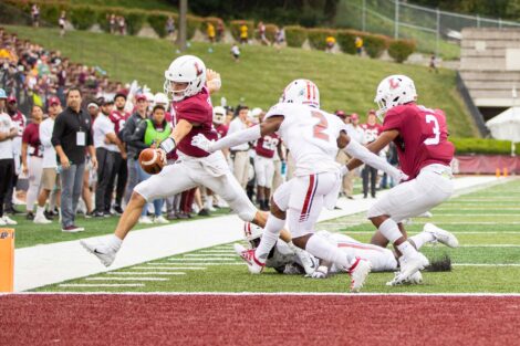 Keegan Shoemaker '23 runs to the end zone and extends the football over the plane of the goal line to score a touchdown.