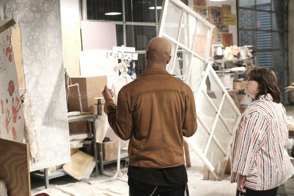 Kim Altomare listens as a student discusses his work