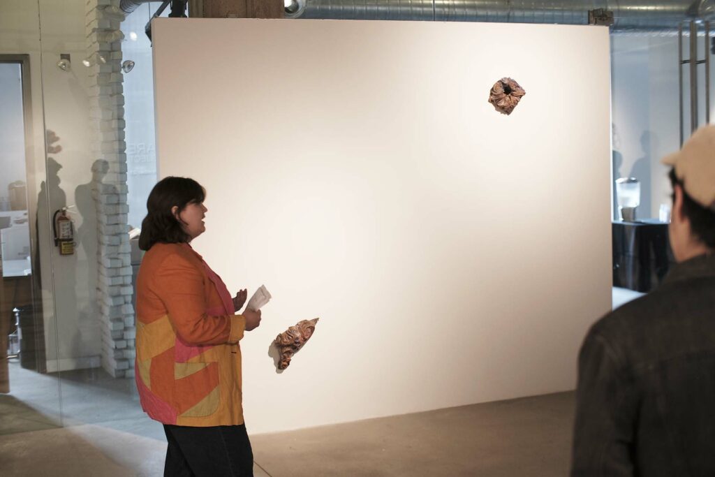 Kim Altomare speaks about two pieces on the wall