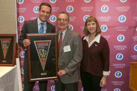 Jonathan Ellis '98, President of the Alumni Association and Lafayette President Allison Byerly present the 2019 Bell Award to John Pierce '81