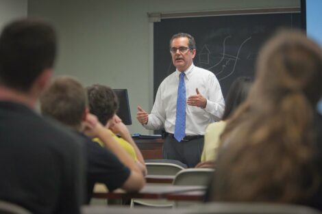 John Pierce '81 talks to students about his long career in the planning, designing and constructing large scale commercial and corporate buildings and real estate throughout the world. Ken White / Zovko Photographic LLC October 3, 2013
