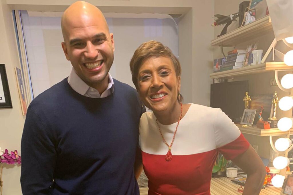 Yusuf stands with Good Morning America host Robin Roberts
