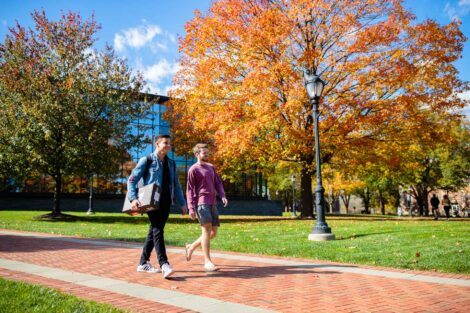 students set against the beautiful oranges and yellows of fall scenery at Lafayette