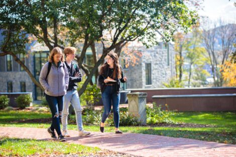 students set against the beautiful oranges and yellows of fall scenery at Lafayette