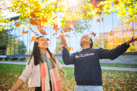 students set against the beautiful oranges and yellows of fall scenery at Lafayette