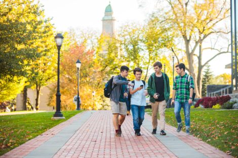 students set against the beautiful oranges and yellows of fall scenery at Lafayette