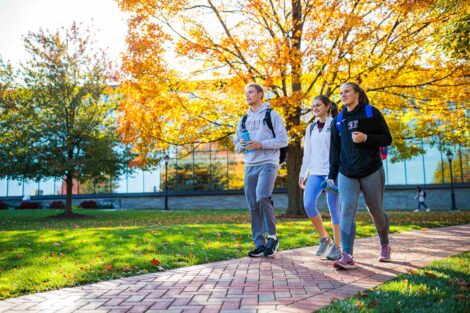 students set against the beautiful oranges and yellows of fall scenery at Lafayette