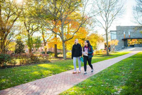 students set against the beautiful oranges and yellows of fall scenery at Lafayette