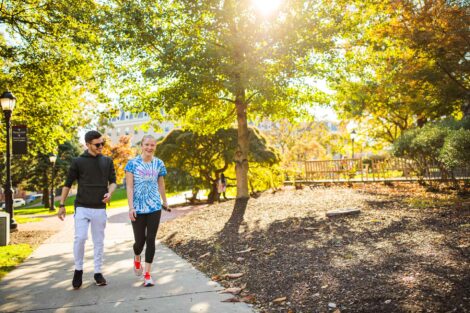 students set against the beautiful oranges and yellows of fall scenery at Lafayette