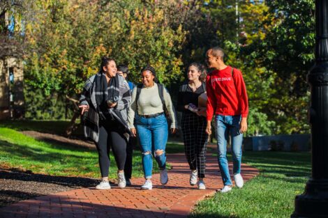 students set against the beautiful oranges and yellows of fall scenery at Lafayette