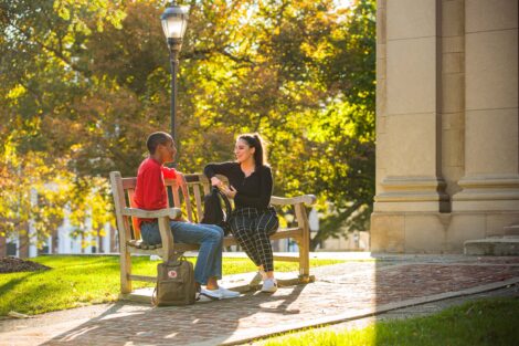 students set against the beautiful oranges and yellows of fall scenery at Lafayette