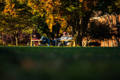 students set against the beautiful oranges and yellows of fall scenery at Lafayette