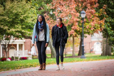 students set against the beautiful oranges and yellows of fall scenery at Lafayette