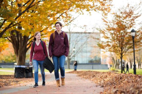 students set against the beautiful oranges and yellows of fall scenery at Lafayette