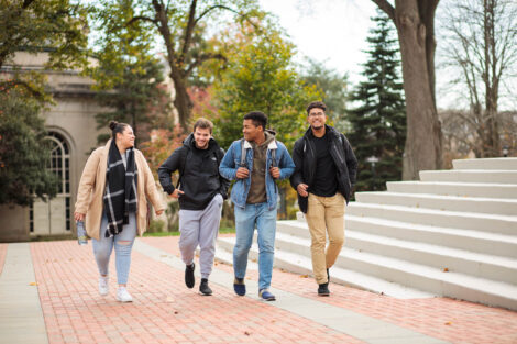 students set against the beautiful oranges and yellows of fall scenery at Lafayette