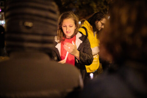 students light candles as part of the take back the night vigil