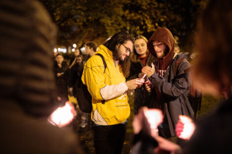 students light candles as part of the take back the night vigil