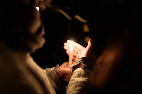 students light candles as part of the take back the night vigil