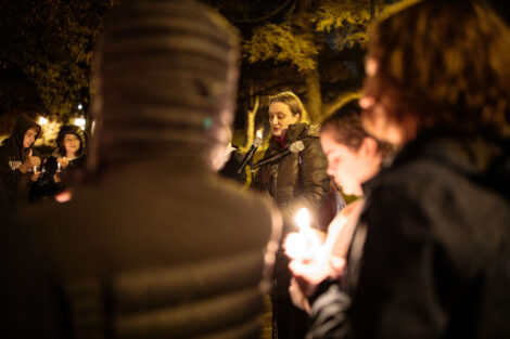 students light candles as part of the take back the night vigil