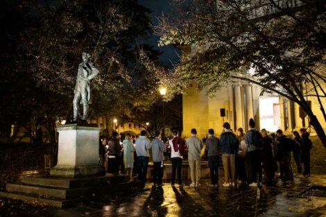 students light candles as part of the take back the night vigil