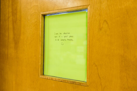 a sign reading i have the attention span of a gerbil please do not disturb thanks covering a window in pardee