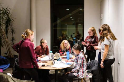Members of the cross country team plan their daily Christmas Countdown video. This one is day three.