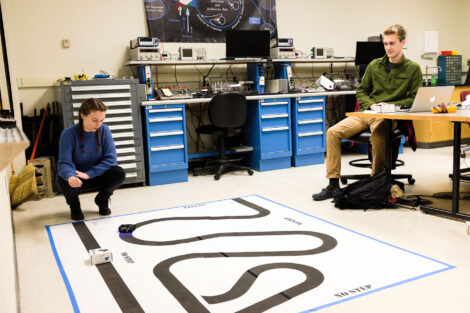 Connor Edson '20 and Hailey Crecca '20 tweak their line-following robots for their Controls project due Saturday. ''I like this class, so I want to put in the effort and work to make it good,'' says Hailey.