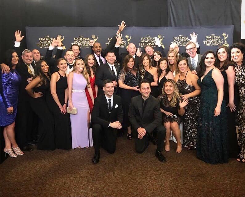 Jen Gsell '04 and her teammates on the Rachael Ray show pose for a group shot at the Emmy Awards