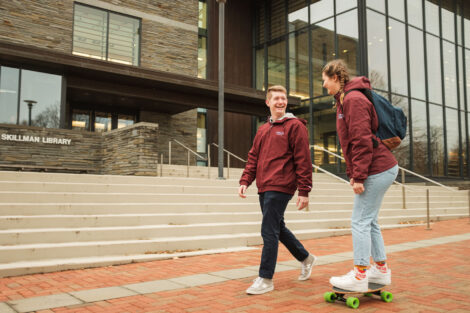Henry Hipp '22 and Lauren Mag '23 finish out their last day of class in front of Skillman Library.