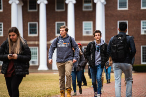 Students walk on campus on the first day of spring semester.