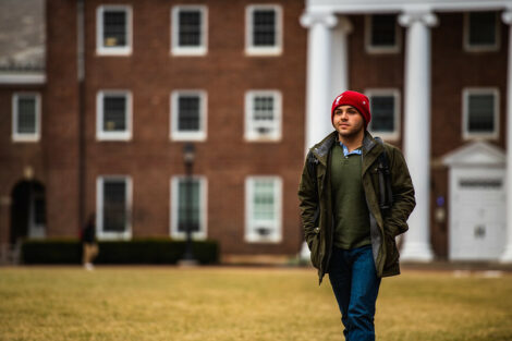 A student walks on campus on the first day of spring semester.