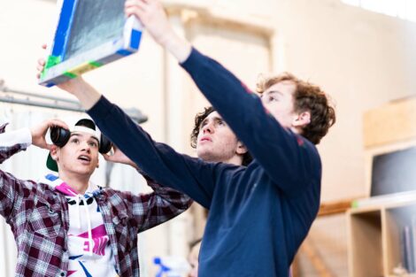 Students hold up a print screen