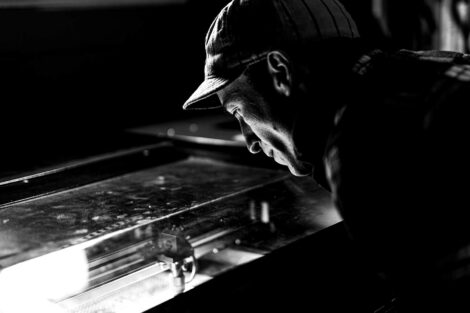 Mike Kondell looks over the laser cutter