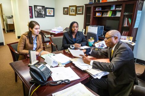 Judge speaks with student externs in his chambers