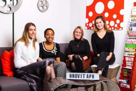 Lafayette alumni at Novita along with student extern sit on couch and smile