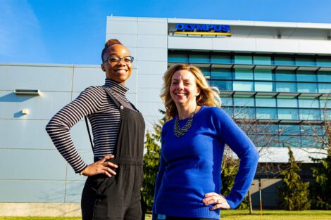Student extern and alumni host outside Olympus headquarters