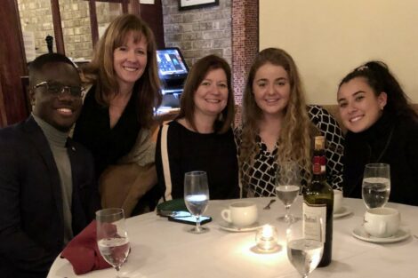 Alumni and externs share a meal