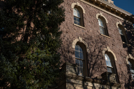 West side of Pardee Hall flanked by two pine trees