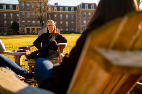 Lafayette College Sustainability Manager Kendall Roberson enjoying a warm Winter day on the Quad. In front of Pardee Hall.