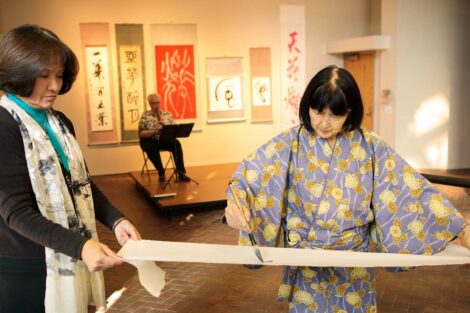 calligraphy master Shuho Kondo uses brush on paper