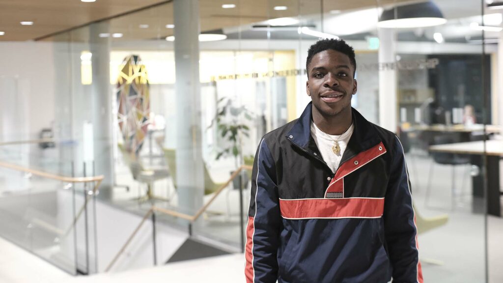 Chisom Njoku ’23 stands outside Dyer Center