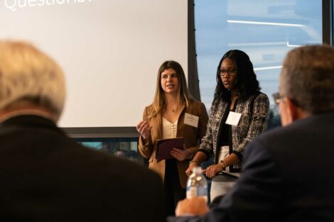 Two students present to judges