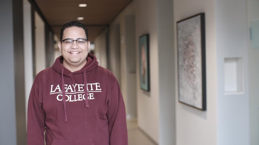 Edward Santos ’22 stands in Rockwell Integrated Sciences Center