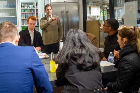 Students listen to speaker inside Easton Public Market