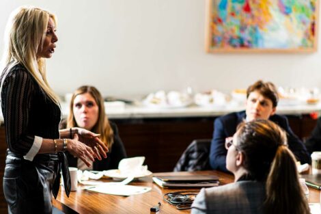 Students listen to an alum