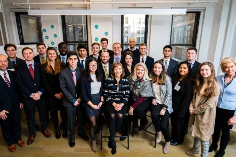 President, administration, alumni volunteers, and students pose for a photo