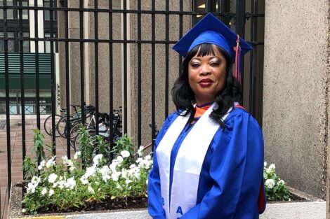 Princess Adeyinka ’20's Mom in graduation cap and gown