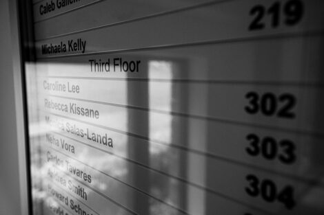 Names of professors on a sign inside of Oechsle Center for Global Education